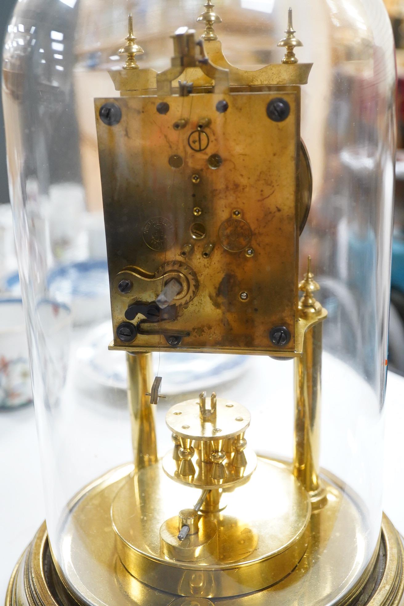 A late 19th century 400 day brass Anniversary clock, under glass dome, 29cm high